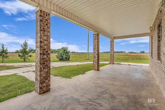 view of patio / terrace featuring a rural view