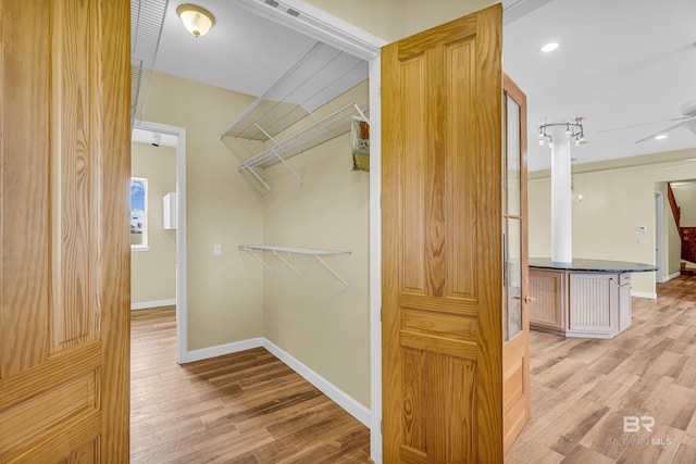 walk in closet featuring light wood-style floors