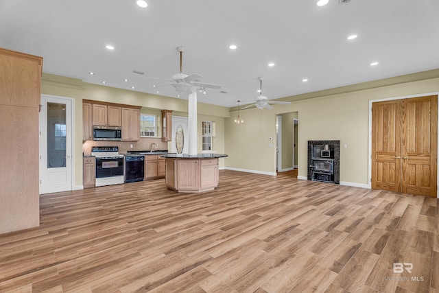 kitchen with stainless steel microwave, open floor plan, a center island, range with electric cooktop, and dishwasher
