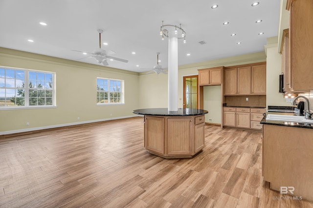 kitchen featuring a sink, recessed lighting, a ceiling fan, and light wood-style floors