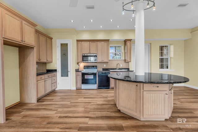 kitchen with recessed lighting, stainless steel microwave, a sink, dishwasher, and range with electric cooktop
