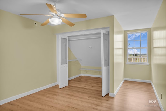 unfurnished bedroom featuring a closet, baseboards, and light wood-type flooring