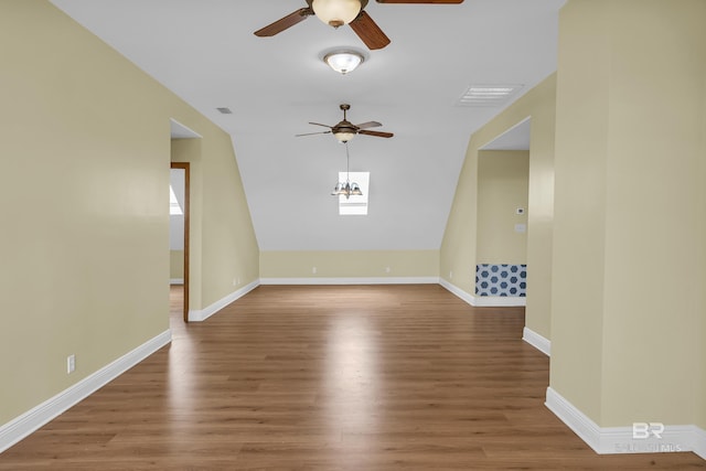 unfurnished room with wood finished floors, ceiling fan, baseboards, and visible vents