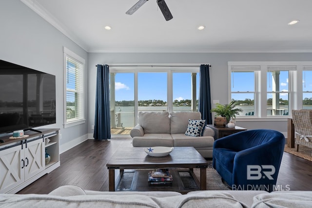 living room featuring baseboards, ornamental molding, and recessed lighting
