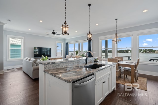 kitchen with plenty of natural light, visible vents, crown molding, dishwasher, and a sink