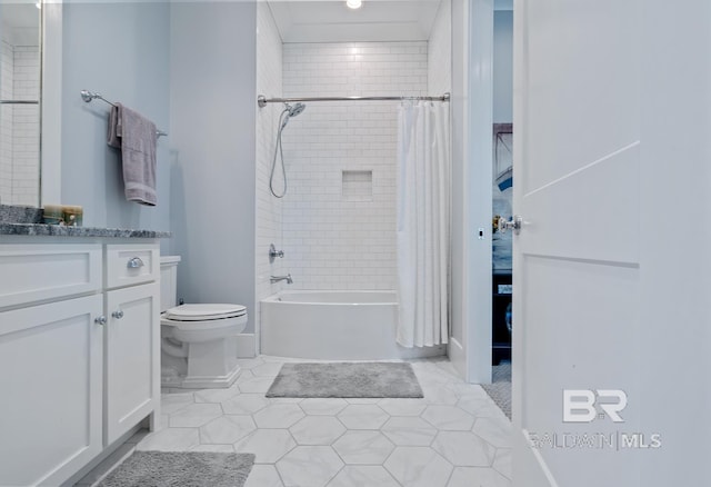 bathroom featuring toilet, tile patterned flooring, shower / tub combo, and vanity