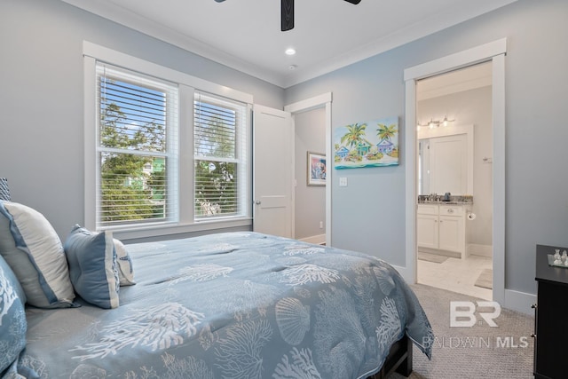 carpeted bedroom featuring baseboards, ensuite bathroom, and a ceiling fan