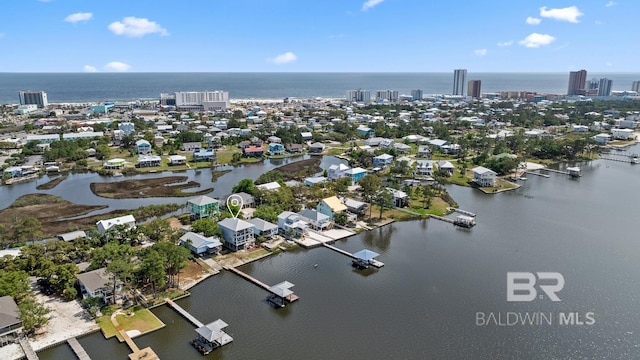 bird's eye view featuring a water view and a city view