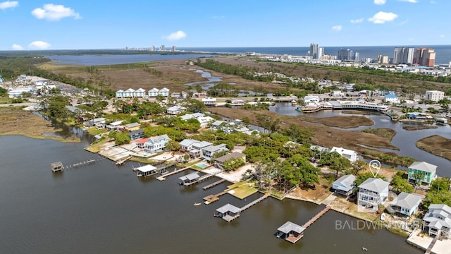 bird's eye view with a view of city and a water view