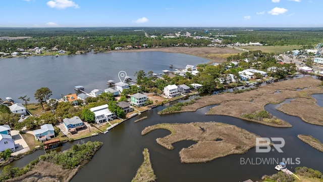 bird's eye view featuring a residential view and a water view