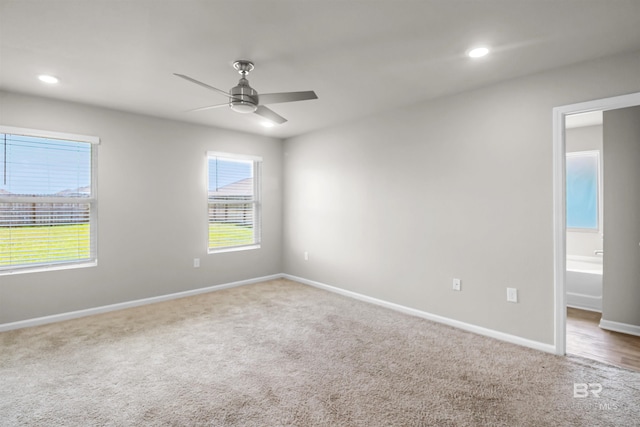 carpeted empty room with recessed lighting, ceiling fan, baseboards, and plenty of natural light