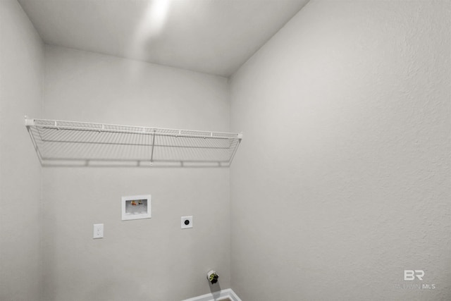 clothes washing area featuring electric dryer hookup, baseboards, laundry area, and hookup for a washing machine