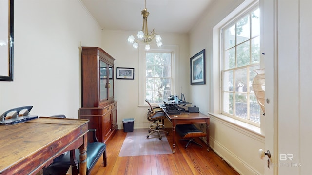 office featuring a chandelier, crown molding, and wood-type flooring