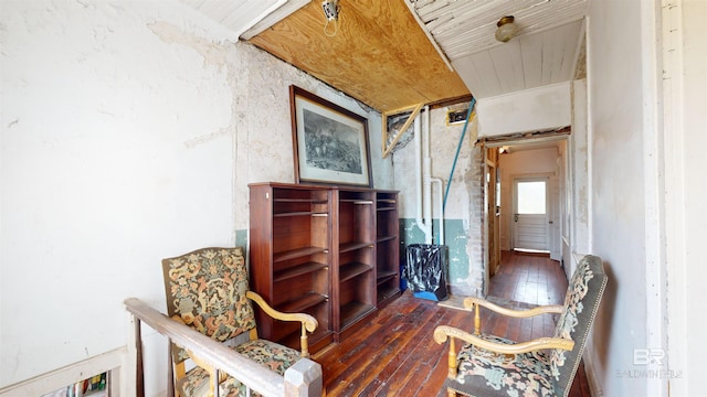 sitting room with dark hardwood / wood-style flooring