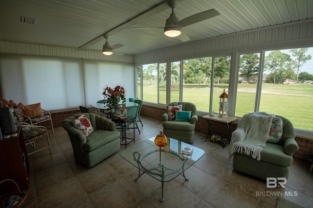 sunroom with ceiling fan and a healthy amount of sunlight