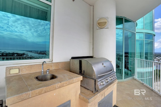 view of patio / terrace featuring an outdoor kitchen, sink, and area for grilling