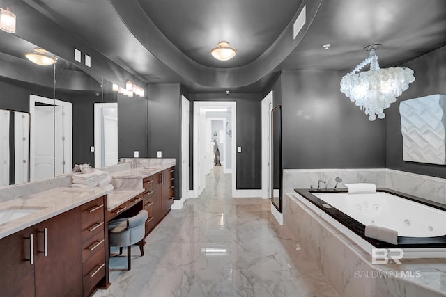 bathroom with vanity, independent shower and bath, a tray ceiling, and a notable chandelier