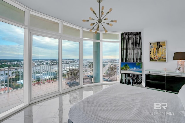 unfurnished bedroom with access to exterior, an inviting chandelier, and floor to ceiling windows