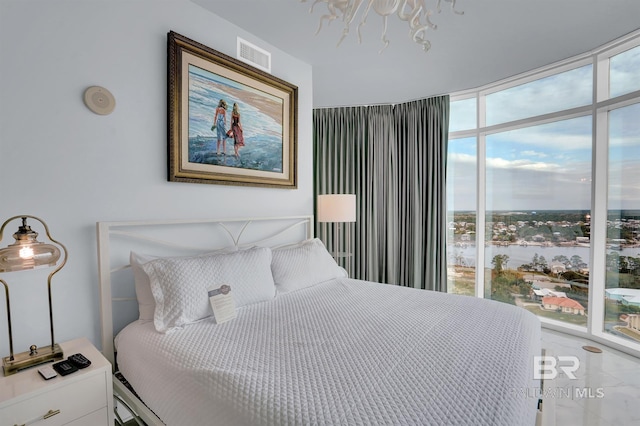 bedroom featuring expansive windows