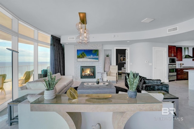 living room featuring a large fireplace