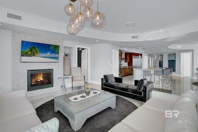 living room featuring a large fireplace