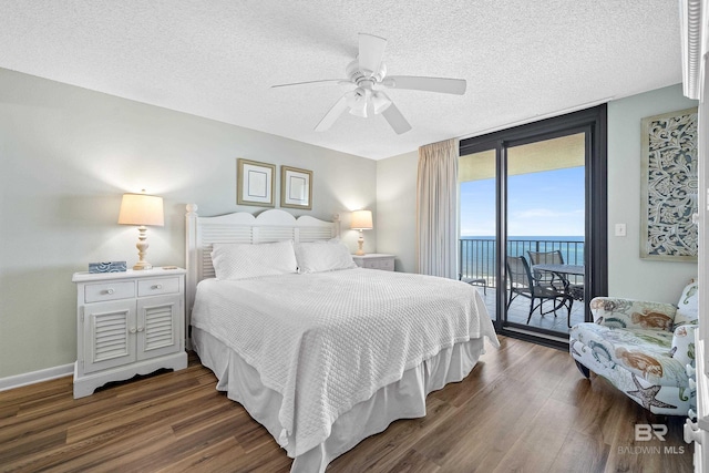 26802 Perdido Beach Blvd Unit 1008, Orange Beach, AL 36561 - bedroom featuring access to outside, dark wood finished floors, a textured ceiling, a water view, and ceiling fan