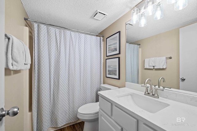 26802 Perdido Beach Blvd Unit 1008, Orange Beach, AL 36561 - full bath with wood finished floors, toilet, a textured ceiling, vanity, and shower / bath combination with curtain
