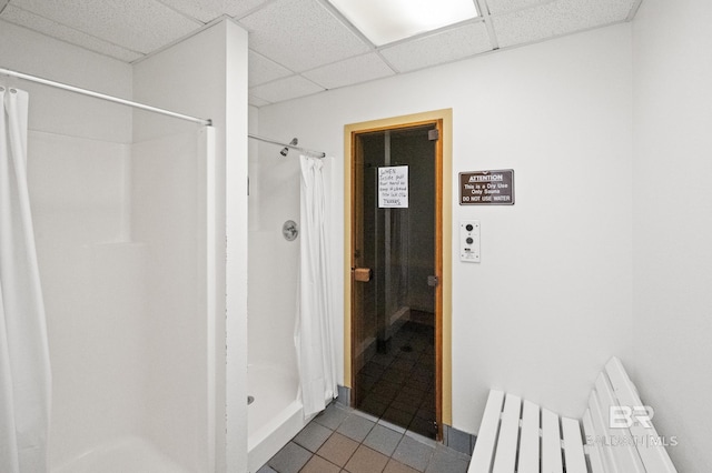 26802 Perdido Beach Blvd Unit 1008, Orange Beach, AL 36561 - full bath featuring tile patterned floors, a stall shower, and a paneled ceiling