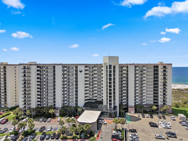 26802 Perdido Beach Blvd Unit 1008, Orange Beach, AL 36561 - view of apartment building / complex with a water view and uncovered parking