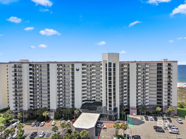 26802 Perdido Beach Blvd Unit 1008, Orange Beach, AL 36561 - view of apartment building / complex with uncovered parking and a water view