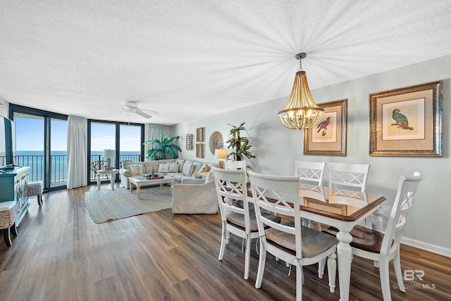 26802 Perdido Beach Blvd Unit 1008, Orange Beach, AL 36561 - dining space with a textured ceiling, a ceiling fan, wood finished floors, a chandelier, and floor to ceiling windows