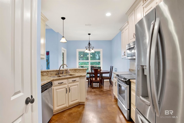 kitchen with an inviting chandelier, stainless steel appliances, light stone counters, pendant lighting, and sink