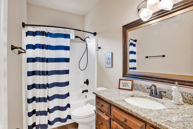 full bathroom featuring shower / bath combo with shower curtain, toilet, and vanity