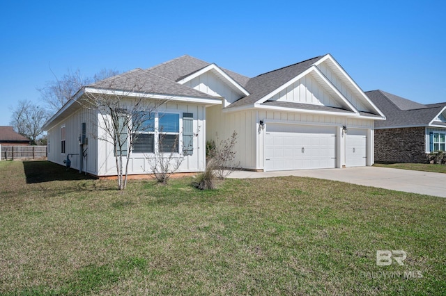 ranch-style home featuring a shingled roof, a front yard, driveway, and an attached garage