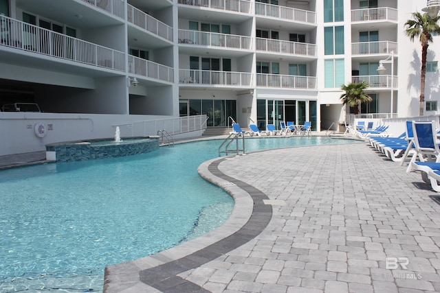 view of pool featuring a patio