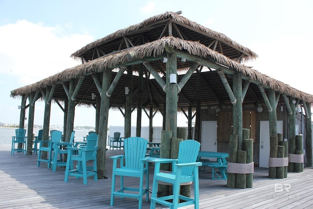 view of property's community featuring a water view and a gazebo