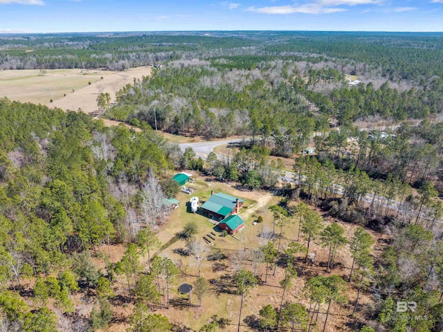 drone / aerial view featuring a view of trees