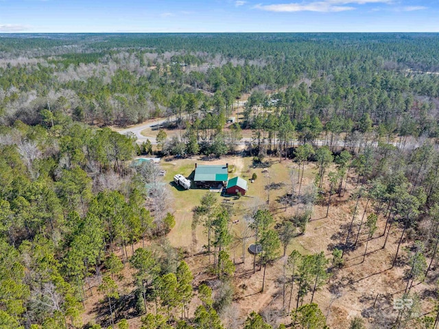 drone / aerial view featuring a view of trees