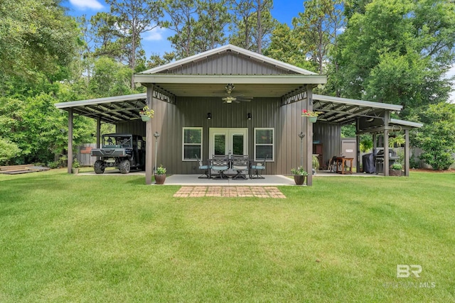 30857 Cypress St, Perdido Beach, AL 36530 - back of property with a yard, a ceiling fan, and french doors