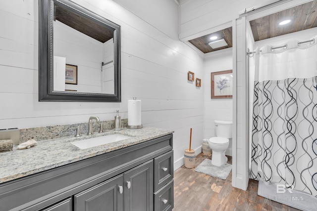 30857 Cypress St, Perdido Beach, AL 36530 - full bathroom featuring wood finished floors, vanity, and a shower with curtain