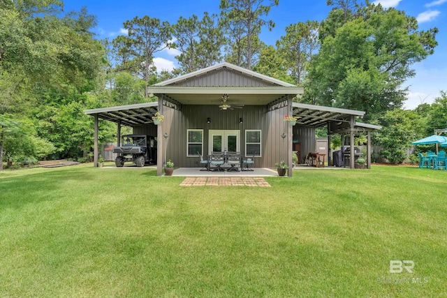 30857 Cypress St, Perdido Beach, AL 36530 - rear view of house with french doors, a lawn, ceiling fan, and a carport