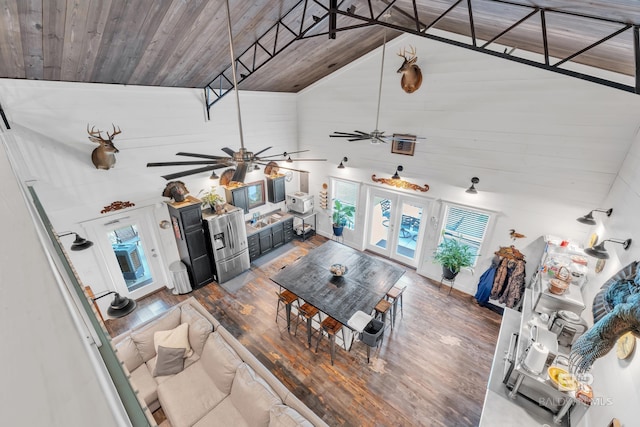 30857 Cypress St, Perdido Beach, AL 36530 - living room featuring high vaulted ceiling, ceiling fan, wooden ceiling, wood finished floors, and wooden walls