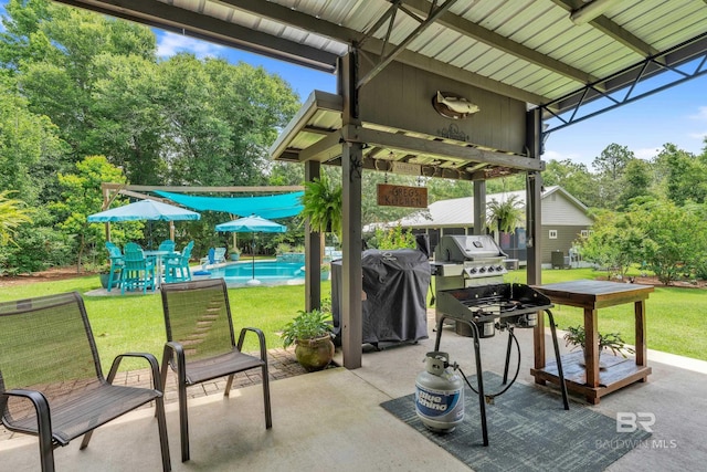 30857 Cypress St, Perdido Beach, AL 36530 - view of patio / terrace featuring an outdoor pool, grilling area, and view of scattered trees
