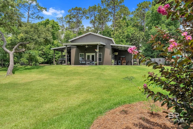 30857 Cypress St, Perdido Beach, AL 36530 - back of house with a yard and a ceiling fan