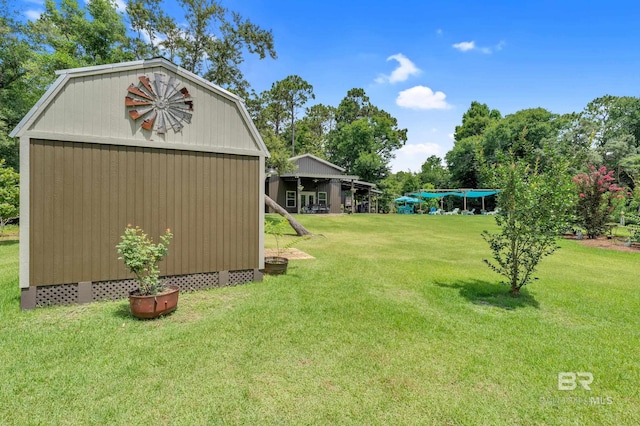 30857 Cypress St, Perdido Beach, AL 36530 - view of grassy yard with a storage unit