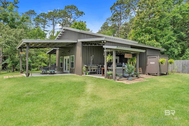 30857 Cypress St, Perdido Beach, AL 36530 - back of property with a patio and board and batten siding