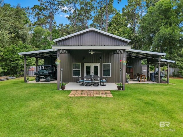 30857 Cypress St, Perdido Beach, AL 36530 - back of house featuring french doors, a lawn, a ceiling fan, a patio, and board and batten siding