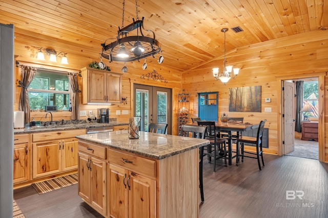 30857 Cypress St, Perdido Beach, AL 36530 - kitchen with french doors, dark wood finished floors, a chandelier, plenty of natural light, and lofted ceiling