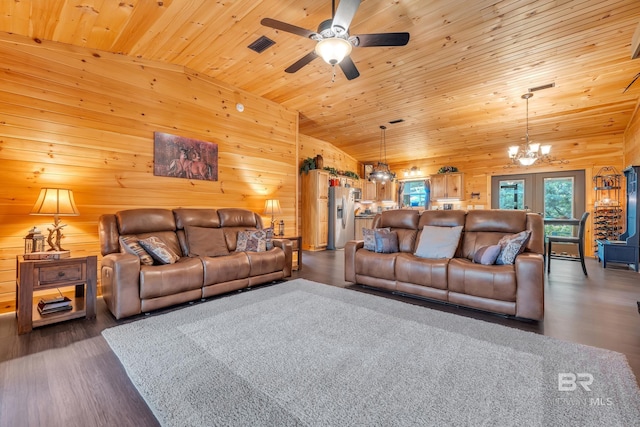 30857 Cypress St, Perdido Beach, AL 36530 - living room featuring dark wood-type flooring, a chandelier, wooden ceiling, a ceiling fan, and wooden walls