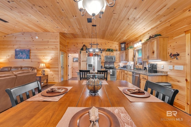 30857 Cypress St, Perdido Beach, AL 36530 - dining room with vaulted ceiling, wood ceiling, wood walls, and a chandelier